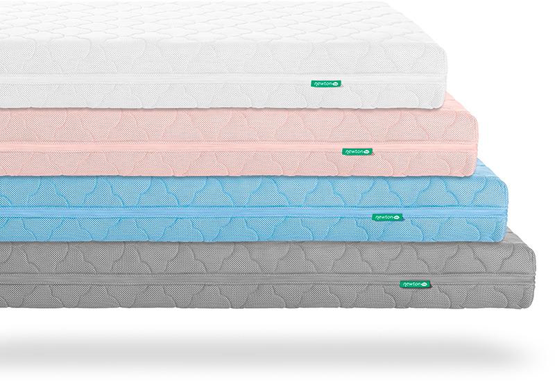 Four Newton baby mattresses stacked on top of each other. From top to bottom, the colors depicted are white, pink, blue, and gray.