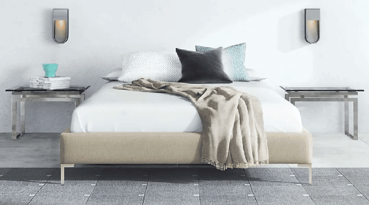 A Saatva Classic mattress on a simple bed frame.