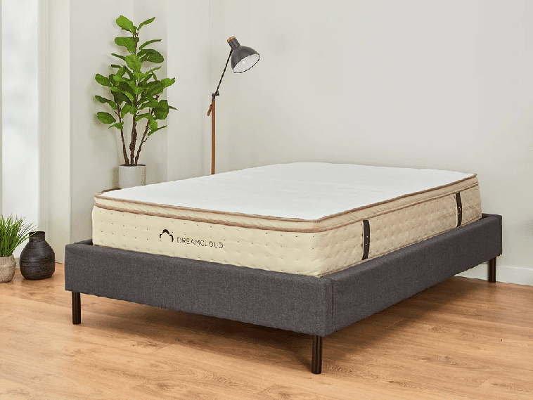 DreamCloud hybrid mattress on simple bed frame for sleep apnea.